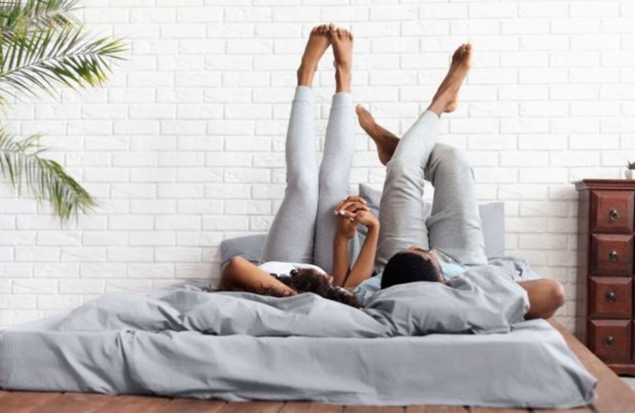 Couple lying down with their feet up.